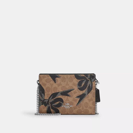 Slim Crossbody Bag In Signature Canvas With Bow Print