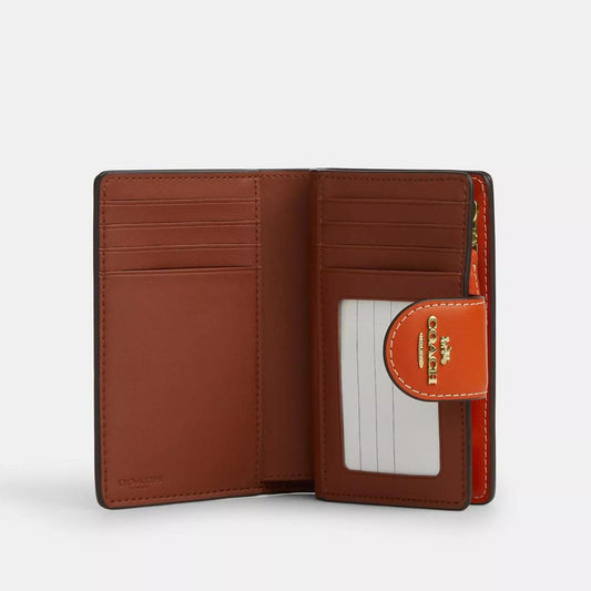 Medium Corner Zip Wallet In Signature Canvas With Orange Print
