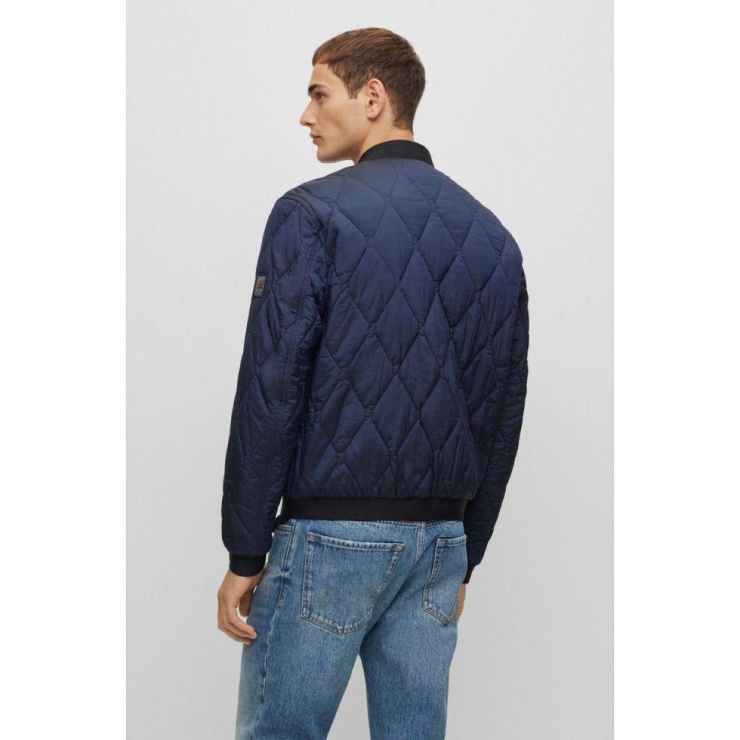 Logo-badge bomber jacket in quilted metallic-effect material