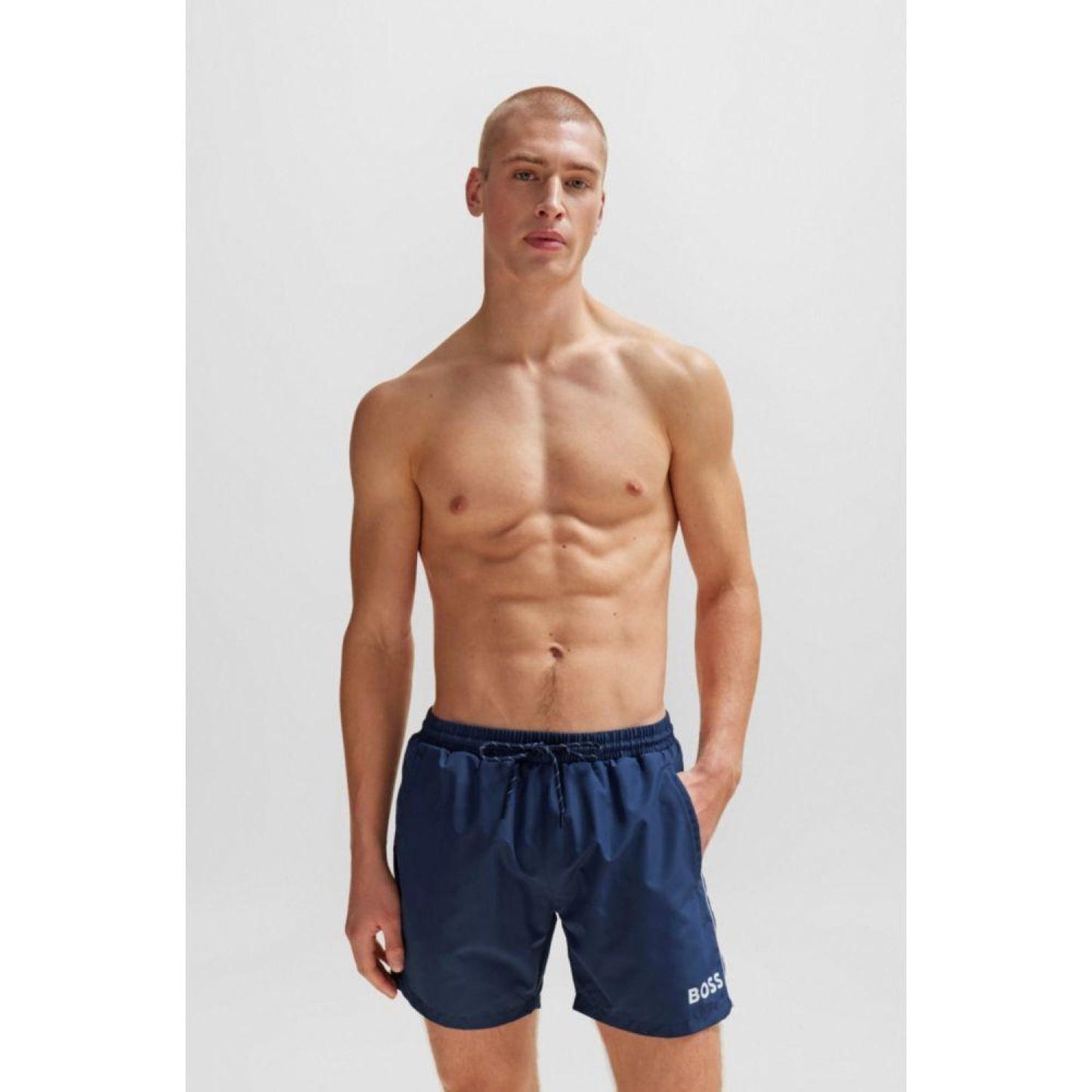 Quick-drying swim shorts with logo and piping