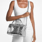 Jet Set Medium Patent Logo Debossed Duffel Crossbody Bag