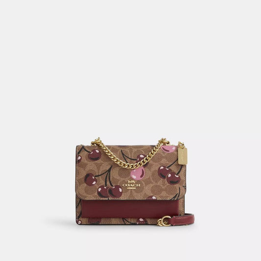 Mini Klare Crossbody Bag In Signature Canvas With Cherry Print