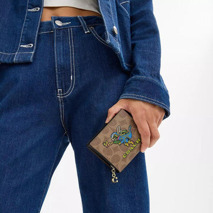 Cosmic Coach Snap Wallet In Signature Canvas With Rexy Print