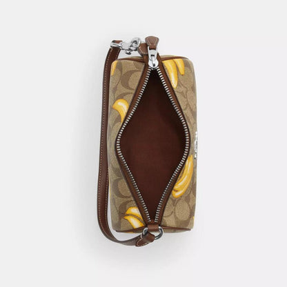 Coach Outlet Nolita Barrel Bag In Signature Canvas With Banana Print