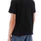 Alexander mcqueen t-shirt with varsity logo and skull print